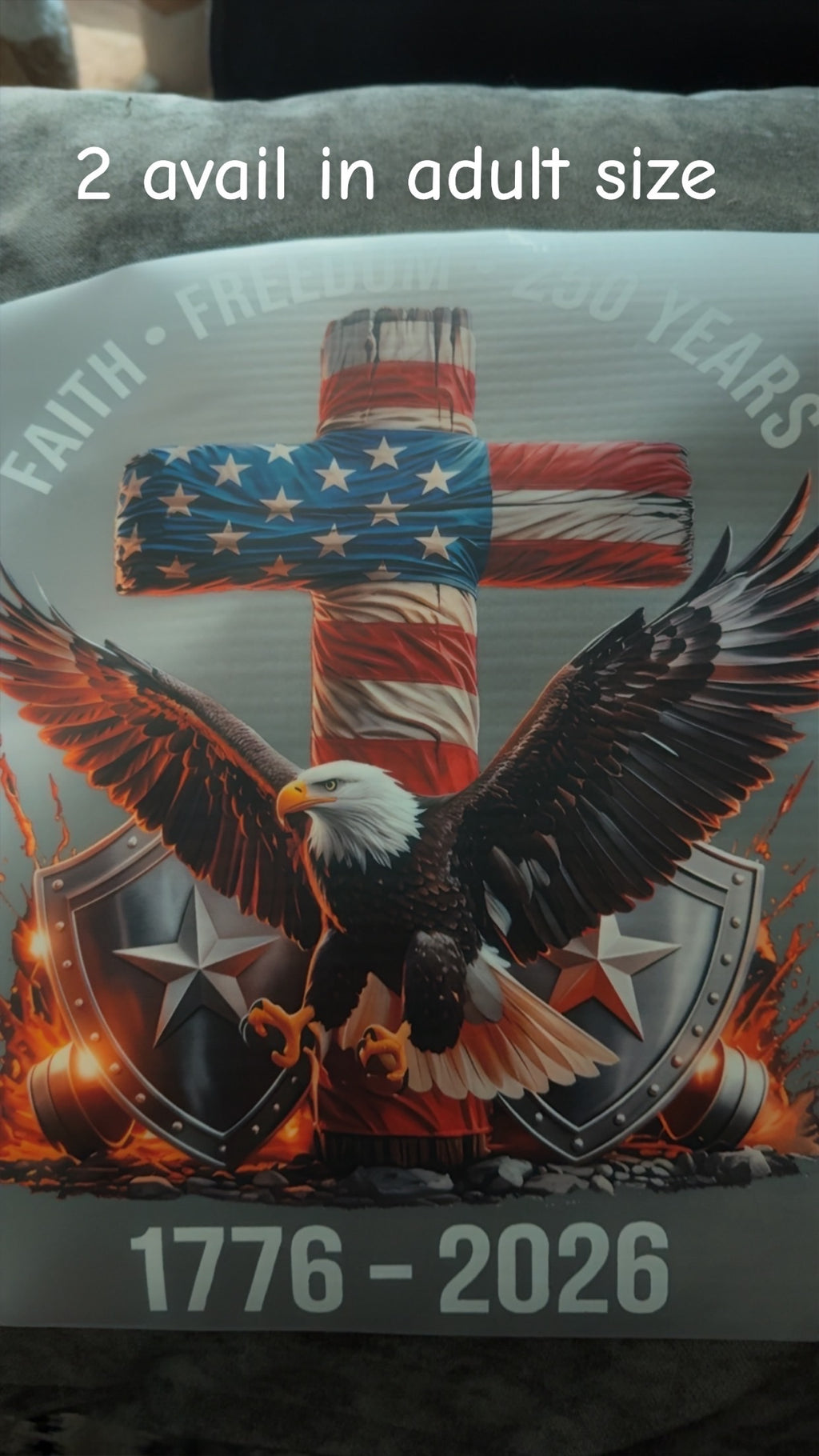 Product with American flag cross and bald eagle design, featuring text '2 avail in adult size' and '1776 - 2026'.